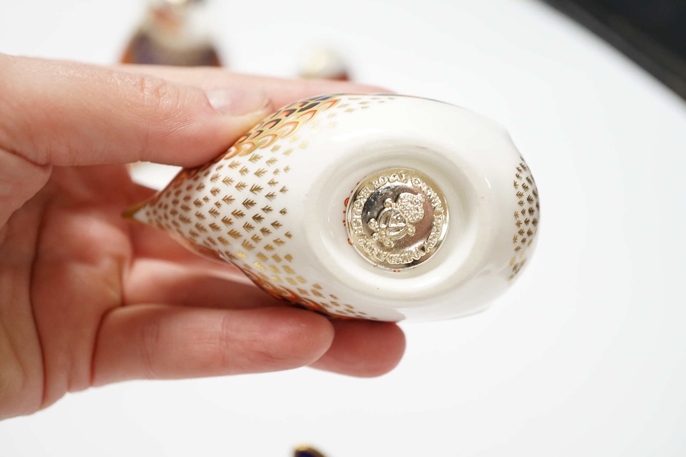 A collection of five Royal Crown Derby animal and bird paperweights